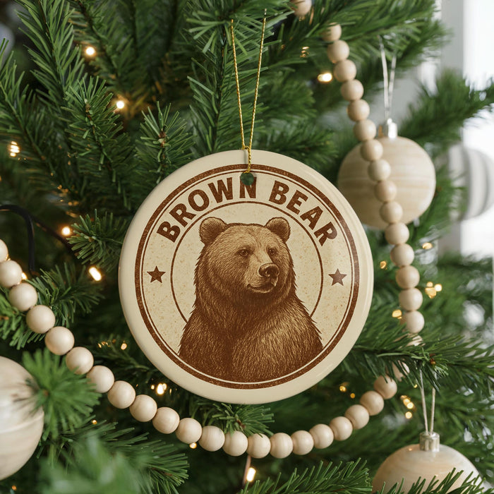 A Christmas tree decorated with ornaments, including a circular ornament with a brown bear image and the text "Brown Bear".