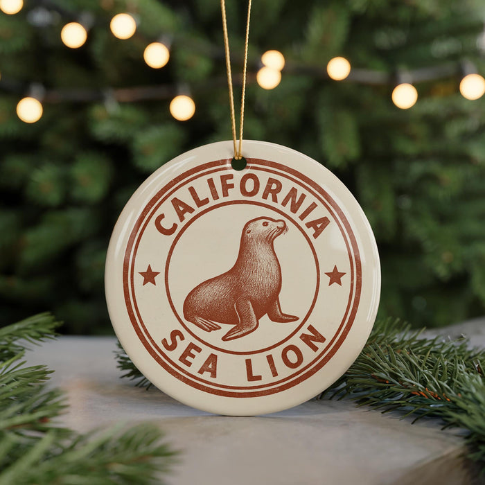 A round ornament with the text "CALIFORNIA SEA LION" and a seal illustration, hanging from a string.