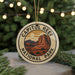 A circular ornament with the text "CAPITOL REEF NATIONAL PARK" and an illustration of a desert landscape with mountains in the background.