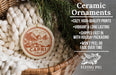 Ceramic ornaments, specifically a ceramic ornament with a design of a coastal town, are displayed in a woven basket.