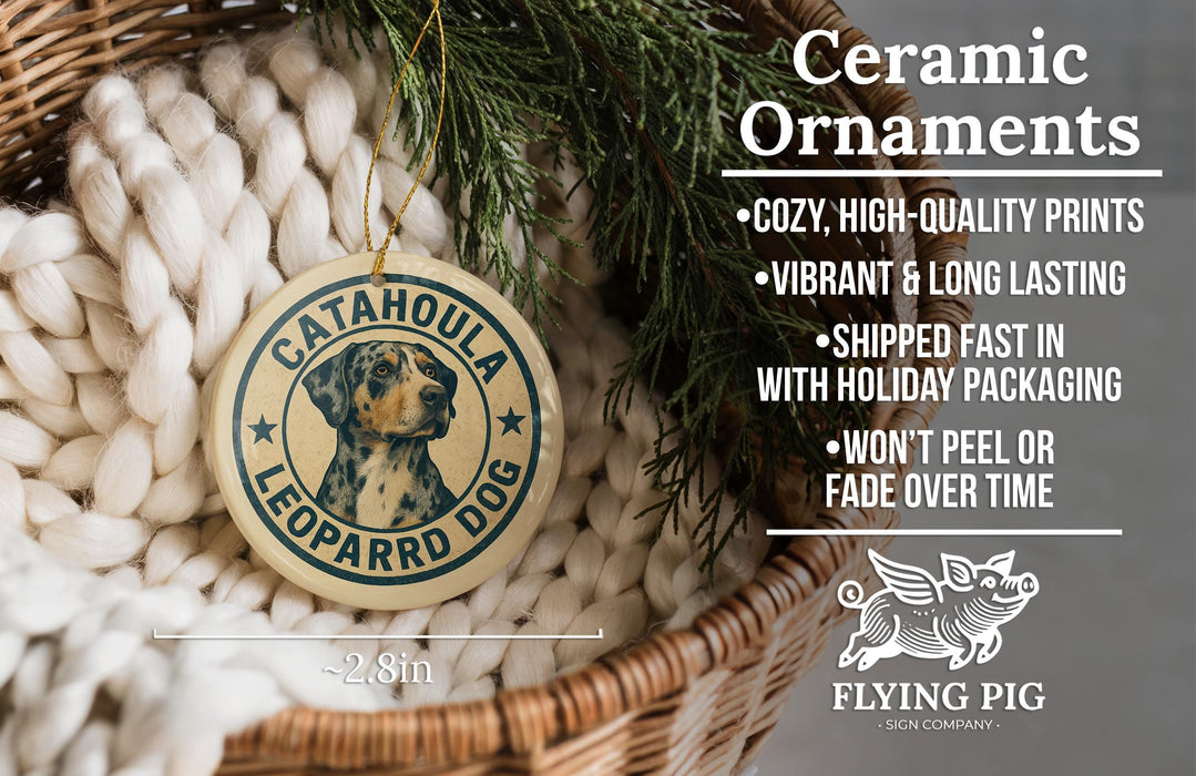 Ceramic ornaments, specifically a leopard dog ornament, are displayed in a basket with greenery.