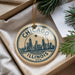 A circular ornament with a city skyline and the text "CHICAGO ILLINOIS USA" is displayed in a box, surrounded by pine branches.