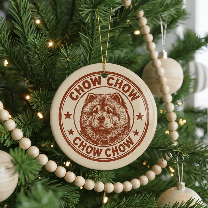 A Christmas tree decorated with ornaments, including a circular ornament with a chow chow dog image and the text "CHOW CHOW" around the edge.