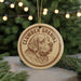 A round ornament featuring a detailed illustration of a Clumber Spaniel dog's head, with the text "CLUMBER SPANIEL" prominently displayed.