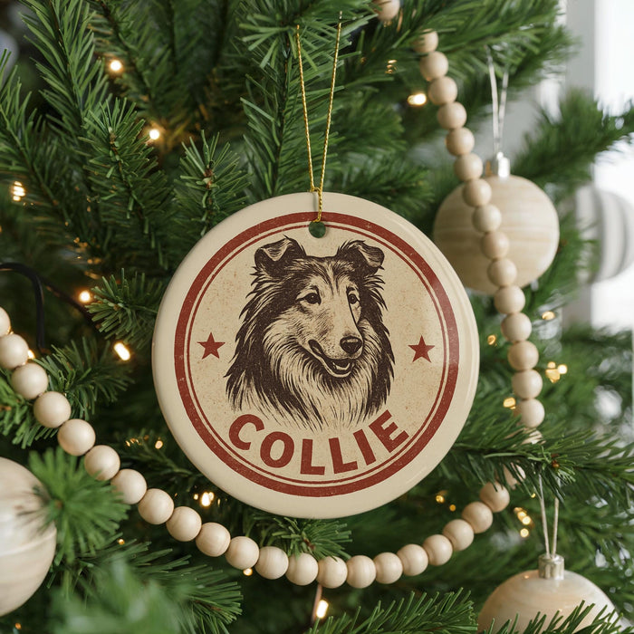 A Christmas tree decorated with ornaments, including a circular ornament with a collie dog image and the name "COLLEIE" written on it.