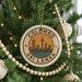 A circular ornament on a Christmas tree, featuring the text "COLOMBO SRI LANKA" and an illustration of the city skyline.