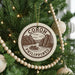 A Christmas tree decorated with ornaments, including a circular ornament with the text "CORON PHILIPPINES" and a boat illustration.