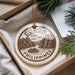 A decorative ornament with the text "CORON PHILIPPINES" and an illustration of a boat on a lake, hanging from a string.