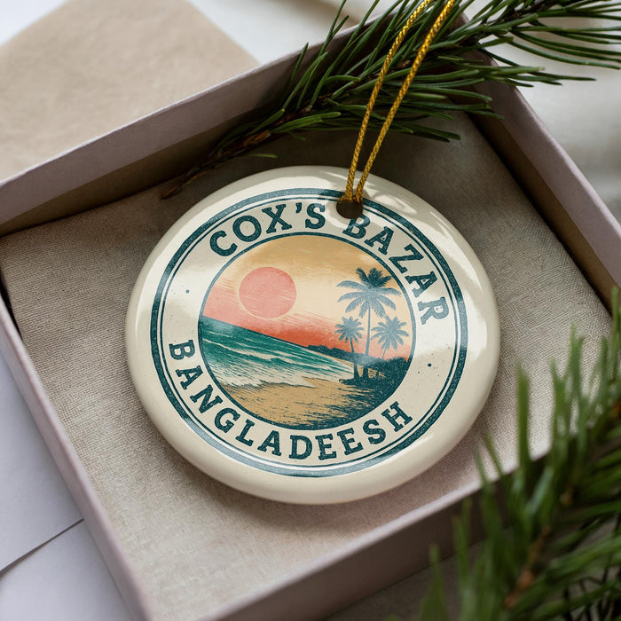 A circular ornament with a tropical beach scene and palm trees, featuring the text "COX'S BAZAR BANGLADESH" on it.