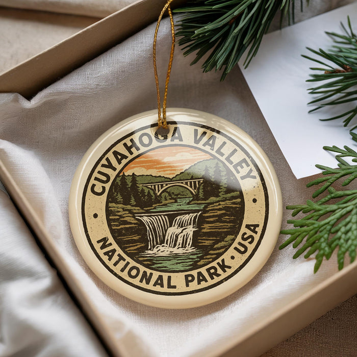 A decorative ornament with the text "CUYAHOGA VALLEY NATIONAL PARK USA" and an illustration of a waterfall surrounded by trees.