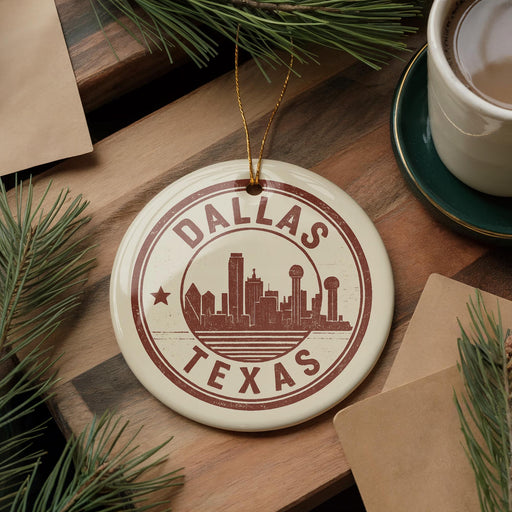 A circular ornament with the text "DALLAS TEXAS" and a silhouette of the Dallas skyline, hanging on a wooden surface.