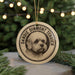 A circular ornament featuring a close-up of a dog's face, with the text "DANDIE DINMONT TERRIER" printed on it.