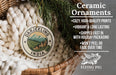 Ceramic ornaments, featuring a design of a mountain landscape with a village, are displayed in a woven basket.