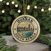 A decorative ornament with the text "DURBAN SOUTH AFRICA" and a cityscape illustration, hanging from a string.