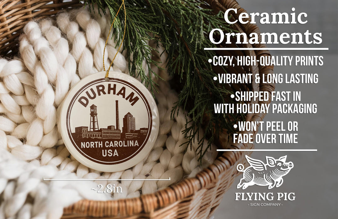 Ceramic ornaments, featuring a ceramic ornament with a city skyline design, are displayed in a woven basket.