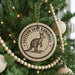 A Christmas tree decorated with ornaments, including a circular ornament with a kangaroo illustration and the text "EASTERN GRAY KANGAROO".
