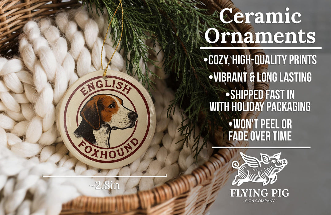 Ceramic ornaments, specifically English Foxhound ornaments, are displayed in a wicker basket. The text highlights the ornaments as "cozy, high-quality prints" and "vibrant & long lasting", with a description of their shipping speed and packaging. The image also includes a logo for "Flying Pig - SIGN COMPANY".