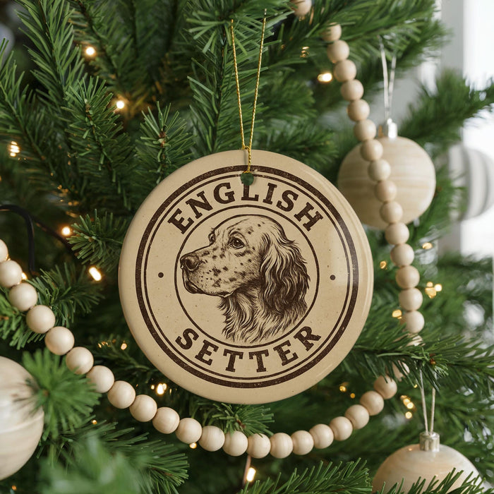 A Christmas tree decorated with ornaments, including a circular ornament with the text "ENGLISH SETTER" and a depiction of a dog's head.