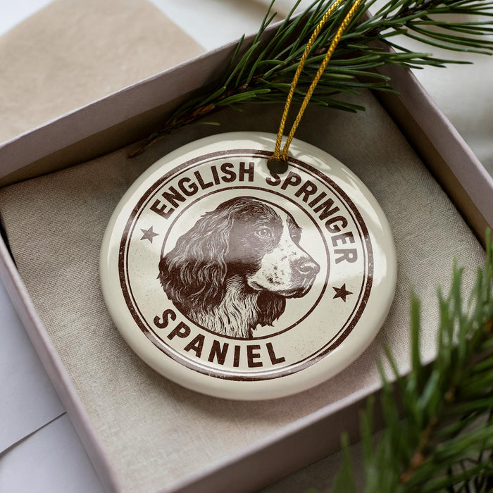 A circular ornament featuring the image of an English Springer Spaniel dog, with the text "English Springer Spaniel" and "Spaniels" printed on it.