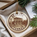 A circular ornament with the text "EPHESUS TURKEY" printed on it, hanging from a string.