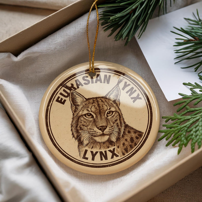 A circular ornament featuring a close-up image of a lynx, a wild cat, with the text "EURASIAN LYNN" printed on it.