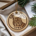 A circular ornament featuring a close-up image of a lynx, a wild cat, with the text "EURASIAN LYNN" printed on it.
