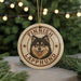 A circular ornament featuring a close-up of a dog's face with the text "FINISH LAPPHUND" around it.