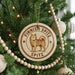 A circular ornament on a Christmas tree featuring a spitz dog, with the text "FINISH SPITZ SPITZ" around the edge.