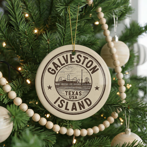 A Christmas tree decorated with ornaments, including a circular ornament that says "GALVESTON TEXAS USA ISLAND".