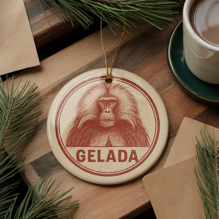 A circular ornament with a red and white design featuring a monkey's face, hanging on a wooden surface.