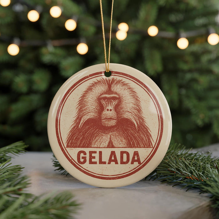 A circular ornament with a red and white design featuring a monkey's face, hanging from a string.