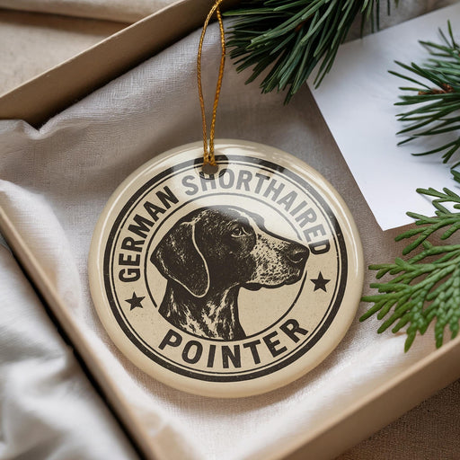 A round ornament with a black and white illustration of a German Shorthaired Pointer dog, surrounded by text that reads "German Shorthaired Pointer".