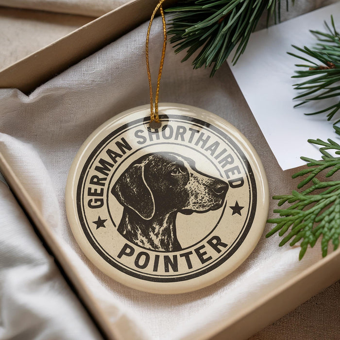 A round ornament with a black and white illustration of a German Shorthaired Pointer dog, surrounded by text that reads "German Shorthaired Pointer".
