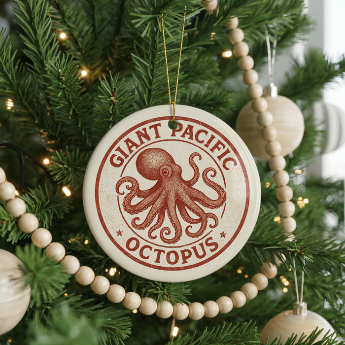 A Christmas tree decorated with ornaments, including a large circular ornament with an image of an octopus and the text "Giant Pacific Octopus".