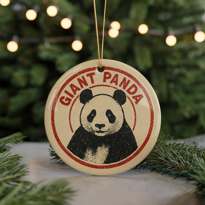 A round ornament featuring a panda bear with the text "GIANT PANDA" on it, hanging from a string.