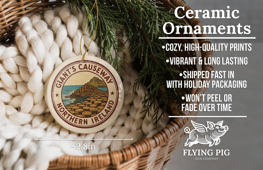 Ceramic ornaments, featuring a design of a coastal landscape with a castle, are displayed in a woven basket.