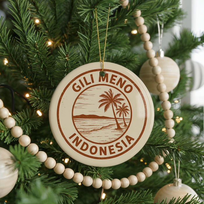A round ornament on a Christmas tree with the text "GILI MENO INDONESIA" printed on it.