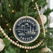 A Christmas tree decorated with ornaments, including a circular ornament with the text "GOThenburg, Sweden" and a bridge illustration.