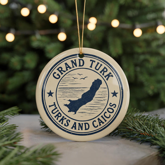 A circular ornament with the text "GRAND TURK TURKS AND CAICOS" and a graphic of a map of the Grand Turk Islands, surrounded by Christmas lights and pine branches.