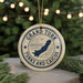A circular ornament with the text "GRAND TURK TURKS AND CAICOS" and a graphic of a map of the Grand Turk Islands, surrounded by Christmas lights and pine branches.