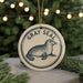A circular ornament featuring a seal, with the text "GRAY SEAL" around the edge.