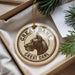 A circular ornament with a dog's head and the text "GREAT DANE" printed on it, hanging from a string.