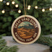 A circular ornament with the text "GREAT SAND DUNES NATIONAL PARK URK" and an illustration of a desert landscape with mountains in the background.