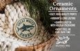 Ceramic ornaments, including a Great White Shark ornament, are displayed in a woven basket.