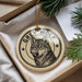 A decorative ornament featuring a close-up image of a grey wolf, with the text "GREY WOLF" around the image.