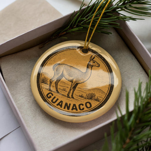 A decorative ornament in a box, featuring a graphic of a llama or alpaca.