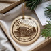 A decorative ornament with a circular design featuring a temple and the text "GYEONGJU SOUTH KOREA" is displayed in a box with pine branches.