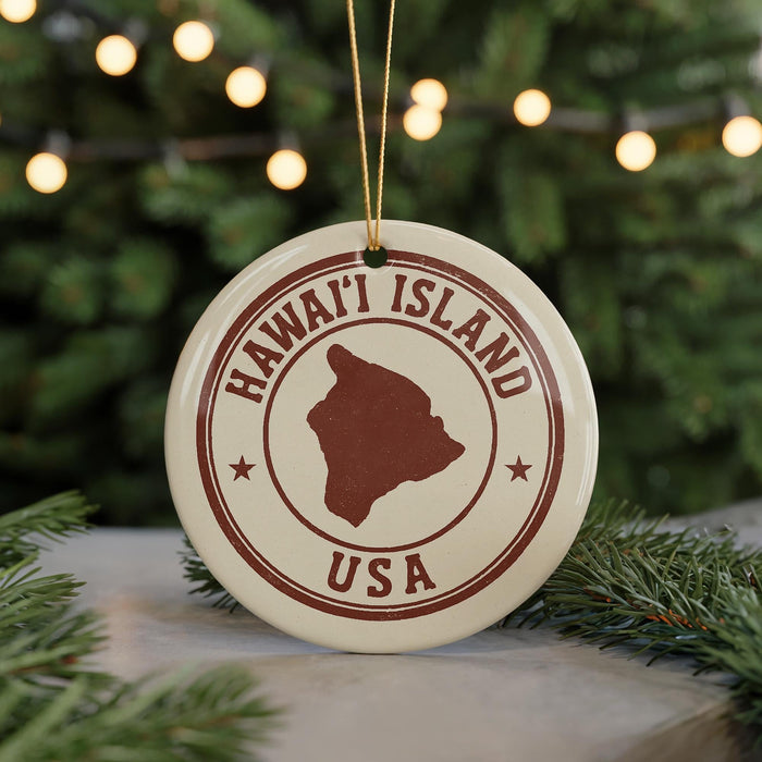 A circular ornament with the text "HAWAII'I ISLAND USA" printed on it, featuring a map of Hawaii and the United States.