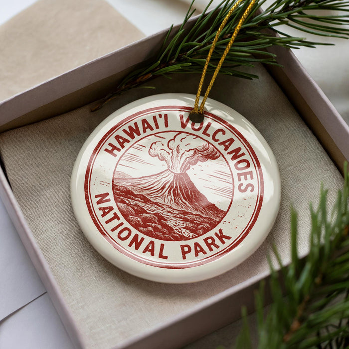 A circular ornament with the text "HAWAII'N VOLCANOES NATIONAL PARK" printed on it, surrounded by pine branches.