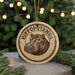 A circular ornament featuring a hippopotamus image, with the text "Hippopotamus" written around the edge.